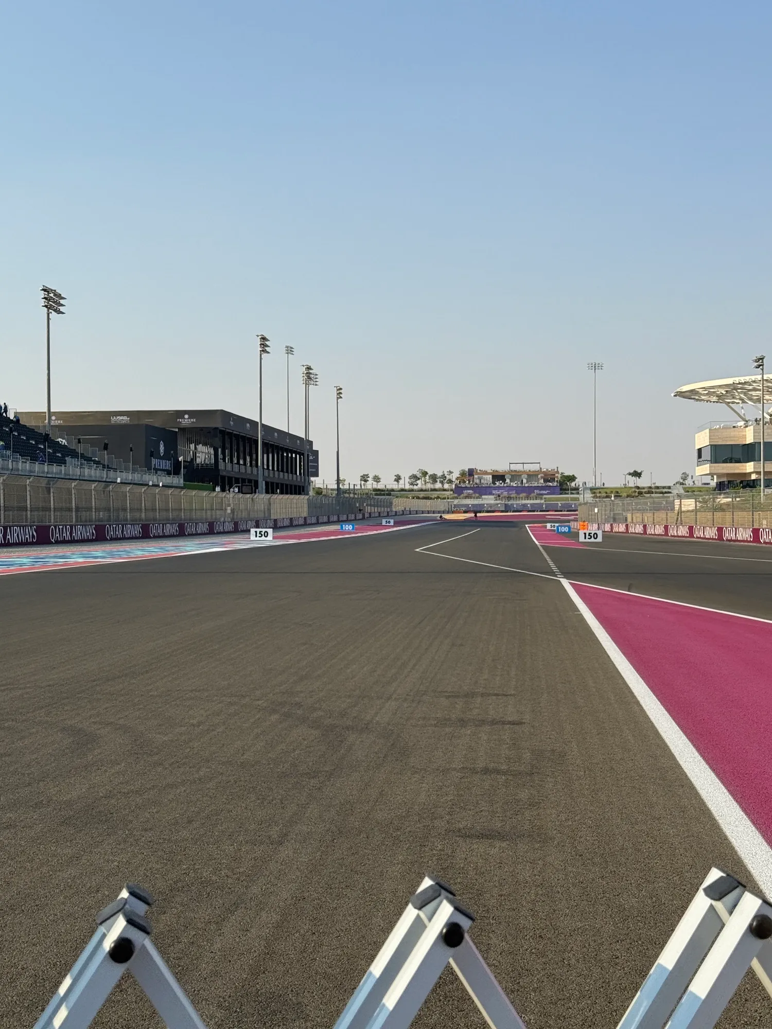 the end of the main straight at lusail, looking down to turn 1 past the braking boards