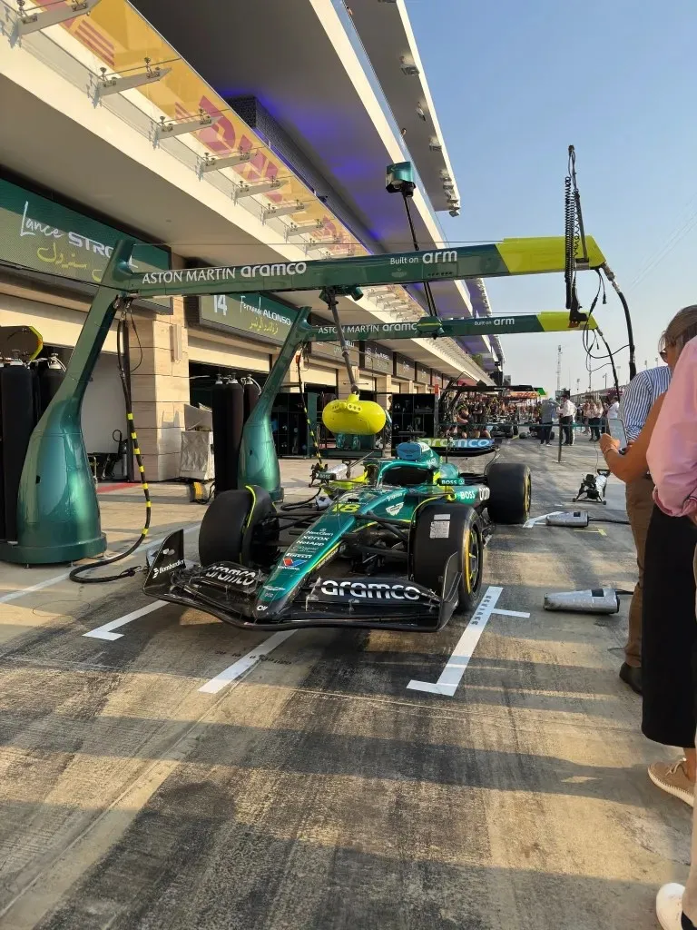 stroll’s aston martin parked in its pit box under the pit stop gantry
