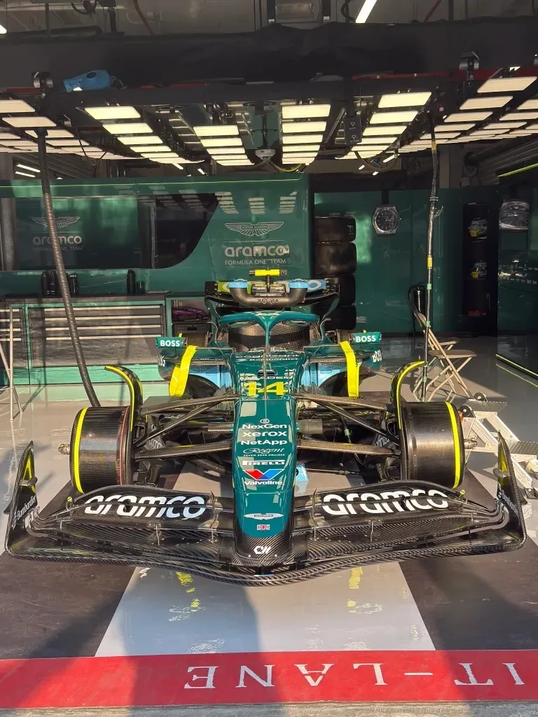 alonso’s number 14 car inside the garage, seen from the pit lane