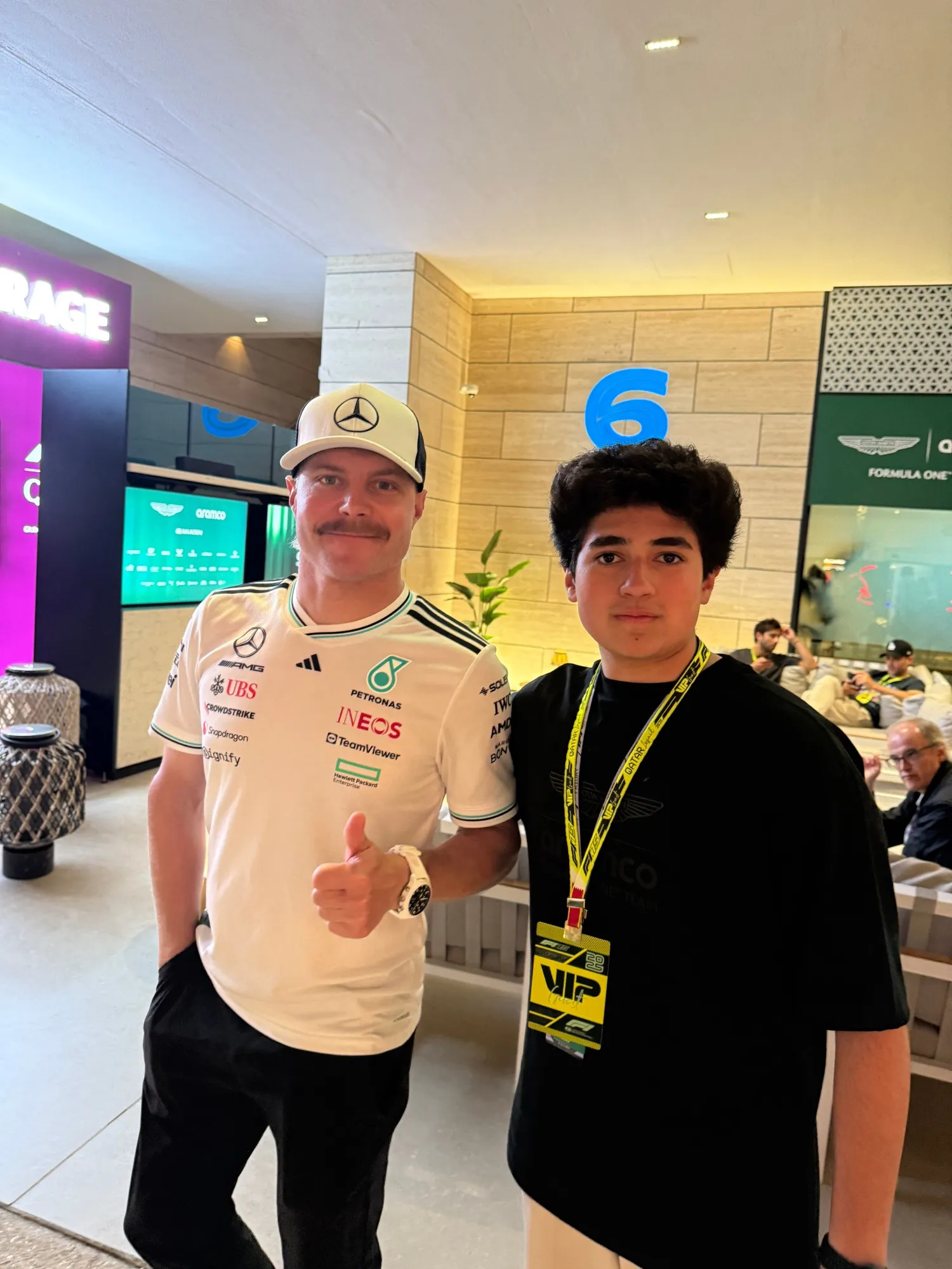 valtteri bottas giving a thumbs up next to me in the paddock