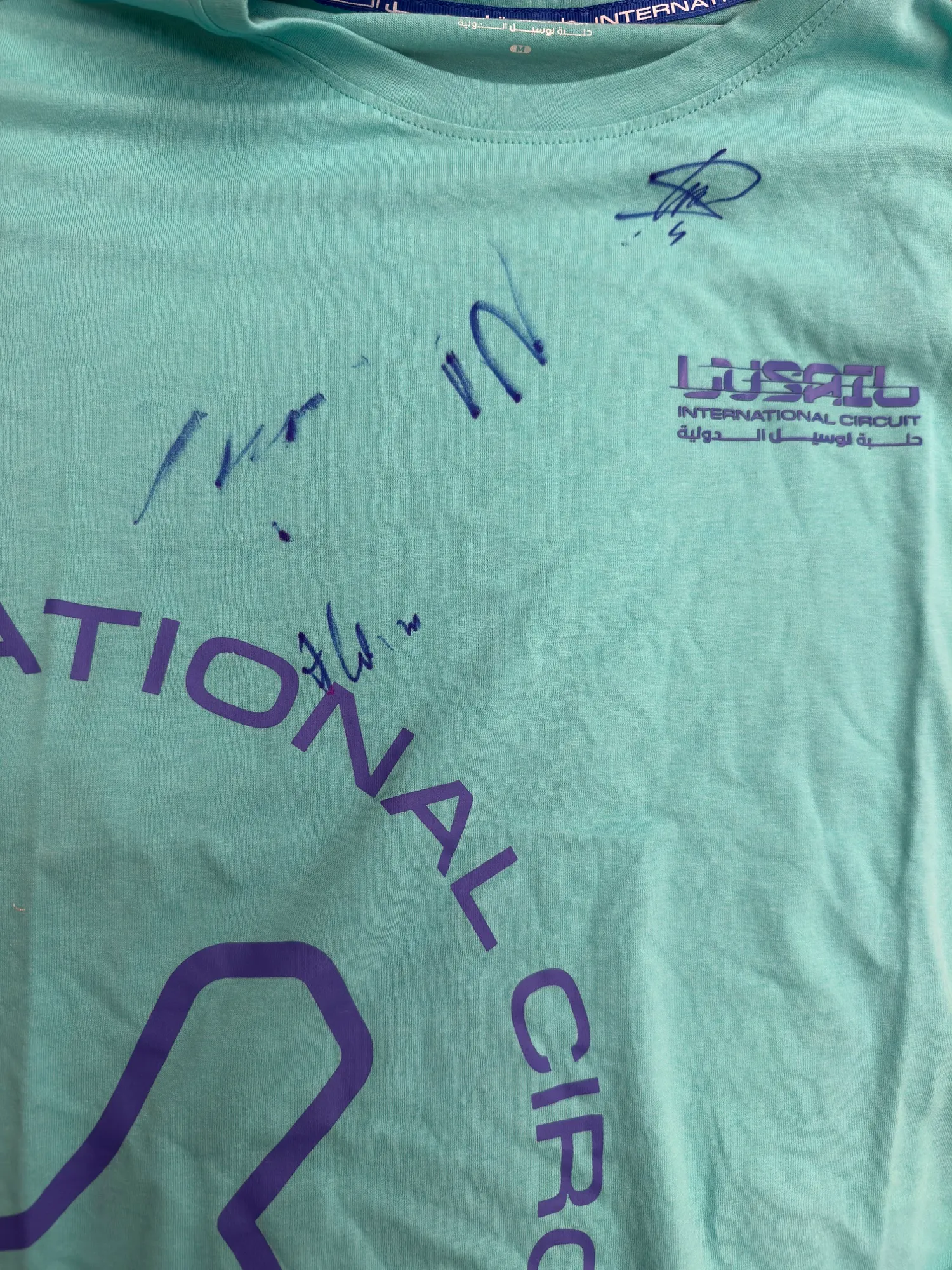 my lusail circuit shirt covered in the signatures i collected